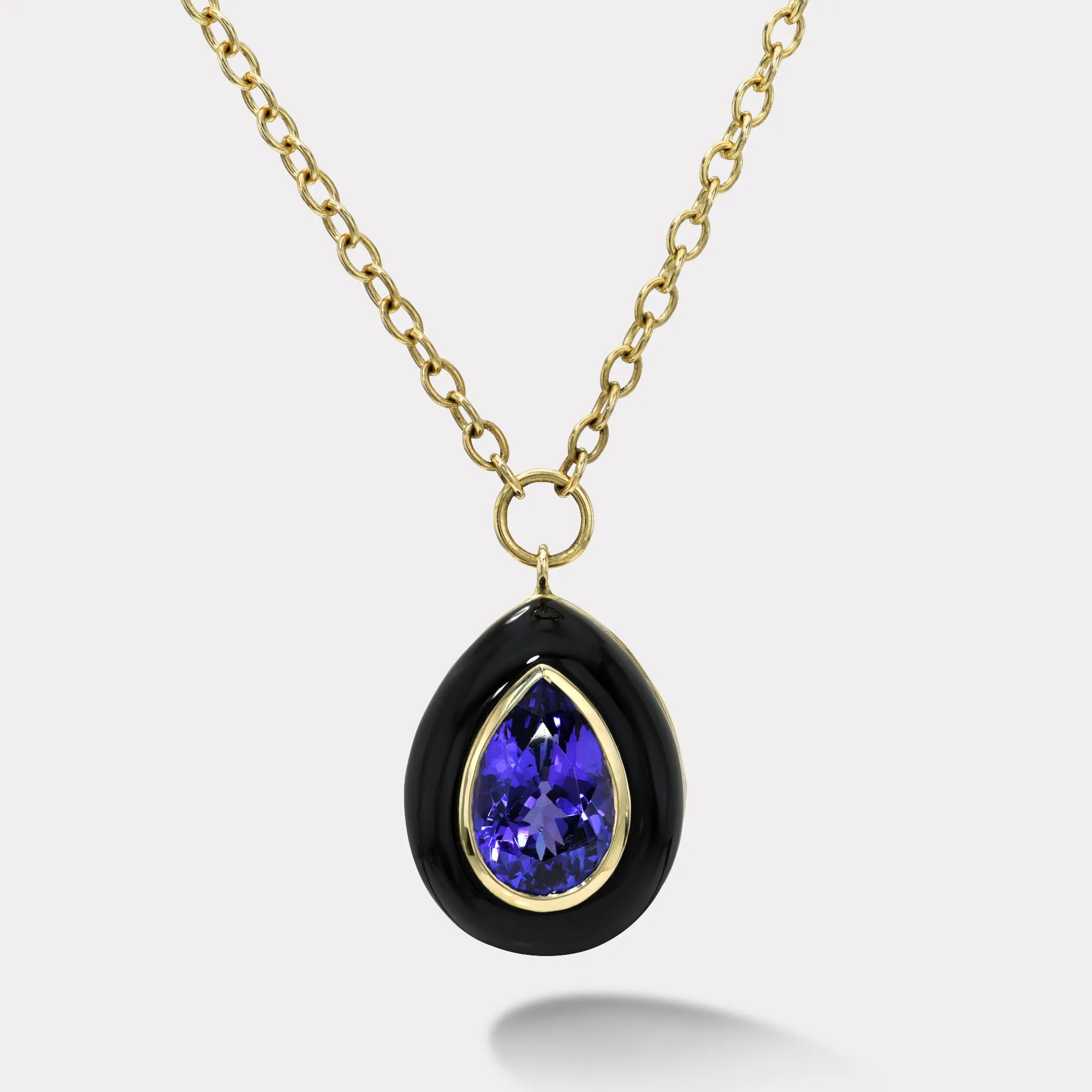 8.46 Pear Tanzanite in Hand Carved Black Jade Lollipop Pendant