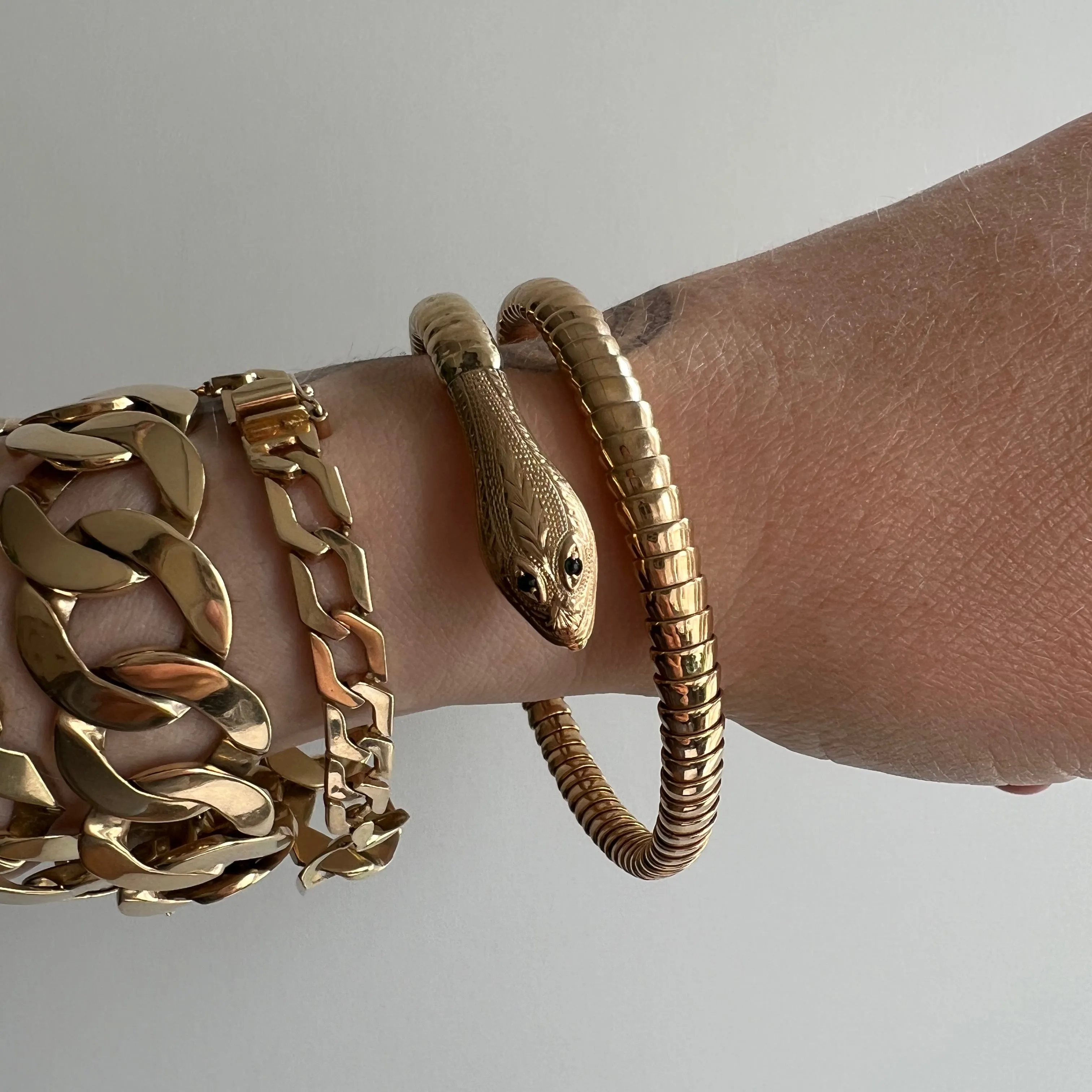 V I N T A G E // wrist protector / 9k yellow gold and emerald wrap around snake bangle / a bracelet